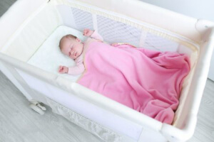 photo of baby sleeping in a crib